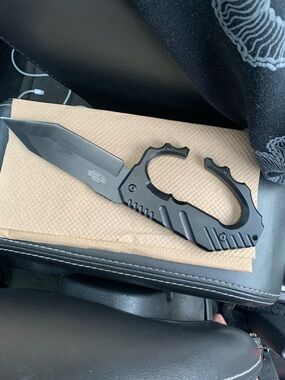 Black Tactical self defense knife / trench knife.